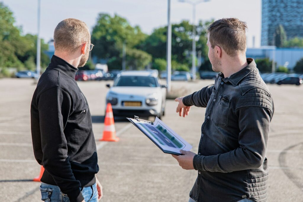 Driving instructor and student in car preparing for the road test