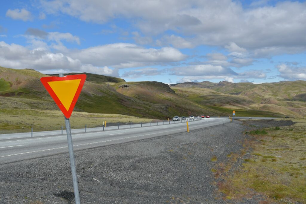 Yield sign on a winding road