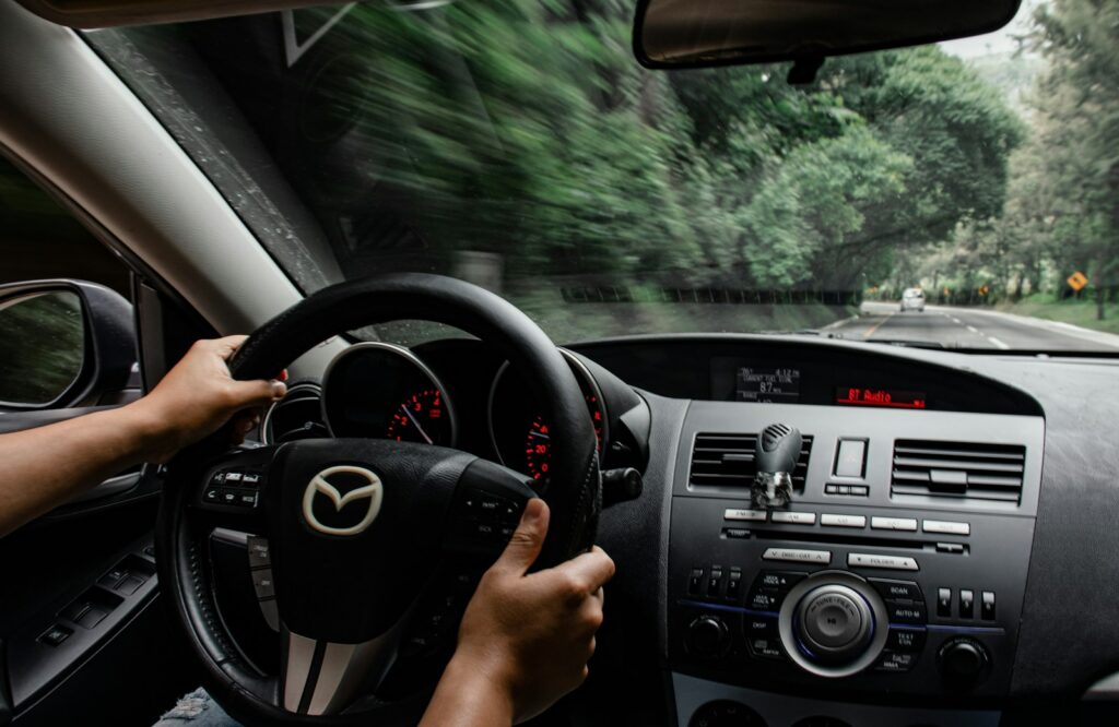 A person driving a car on an open road