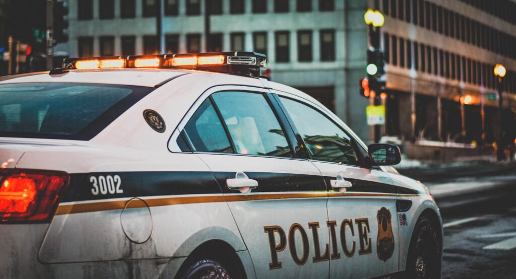 A police patrol car parked along a city street