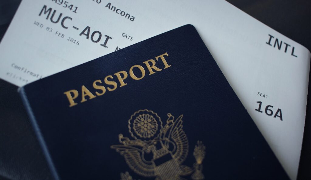 A foreign passport resting on paperwork on a desk