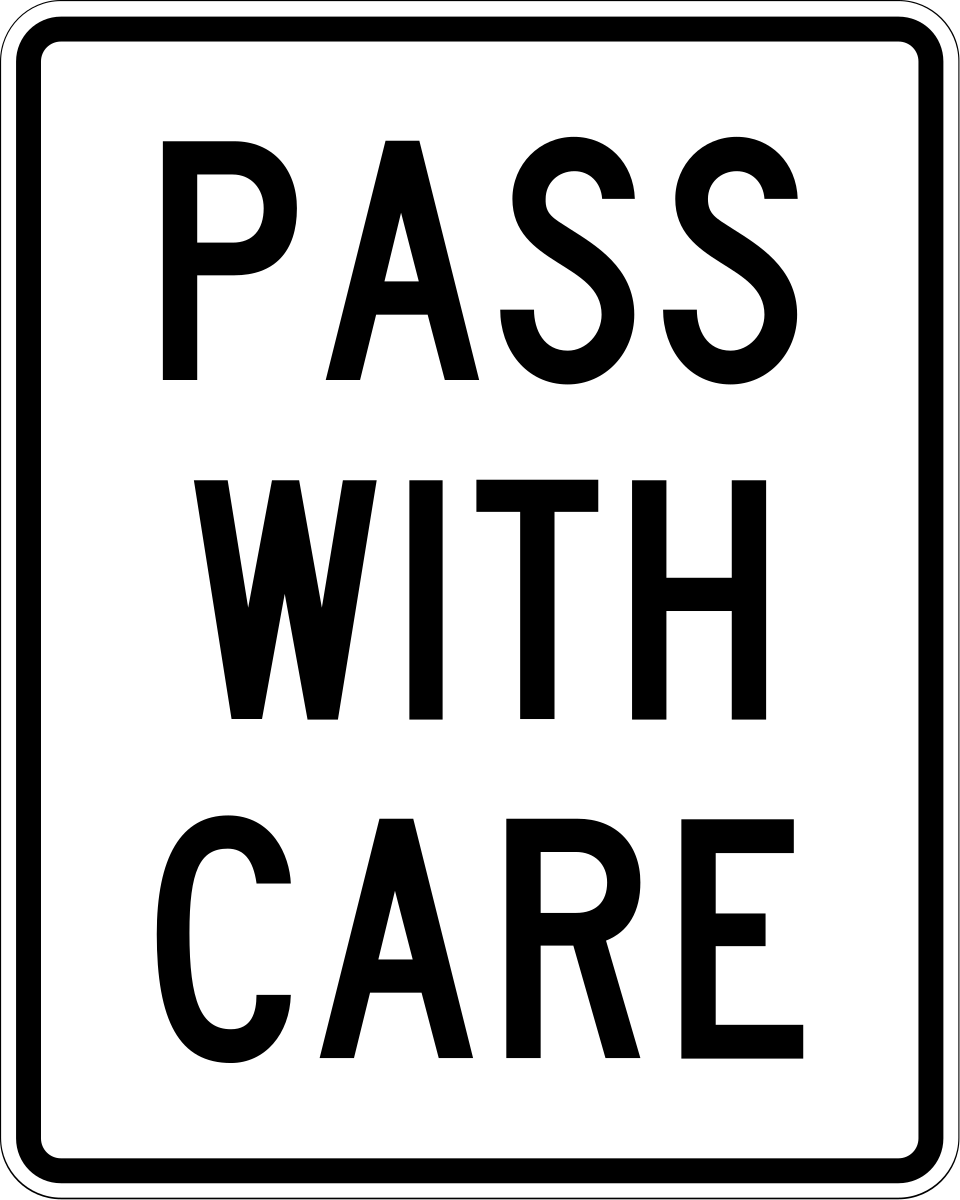 Black and white rectangular PASS WITH CARE regulatory sign, MUTCD code R4-2