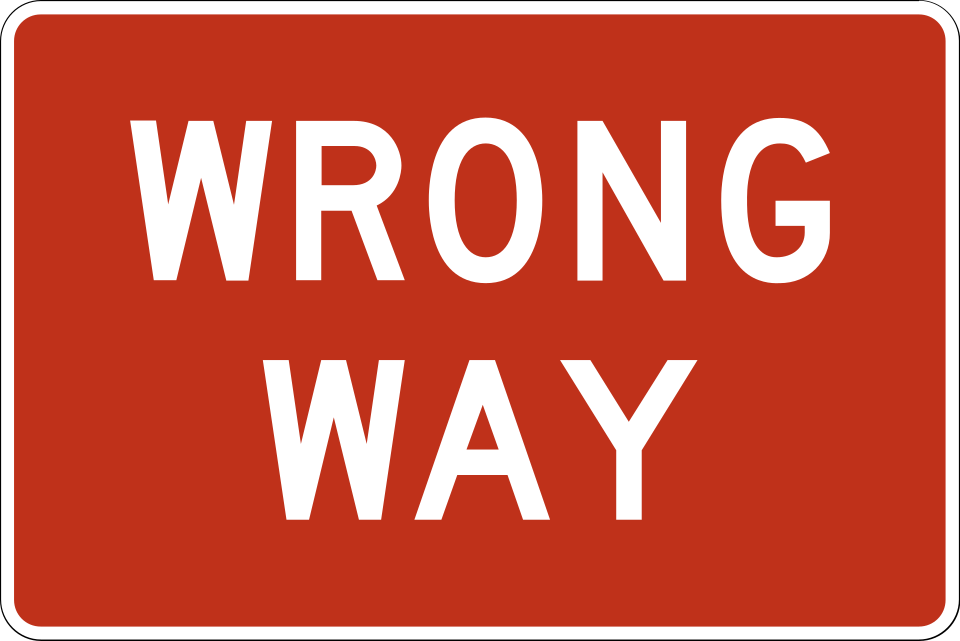 Red and white horizontal rectangular WRONG WAY regulatory sign, MUTCD code R5-1a, wider than it is tall